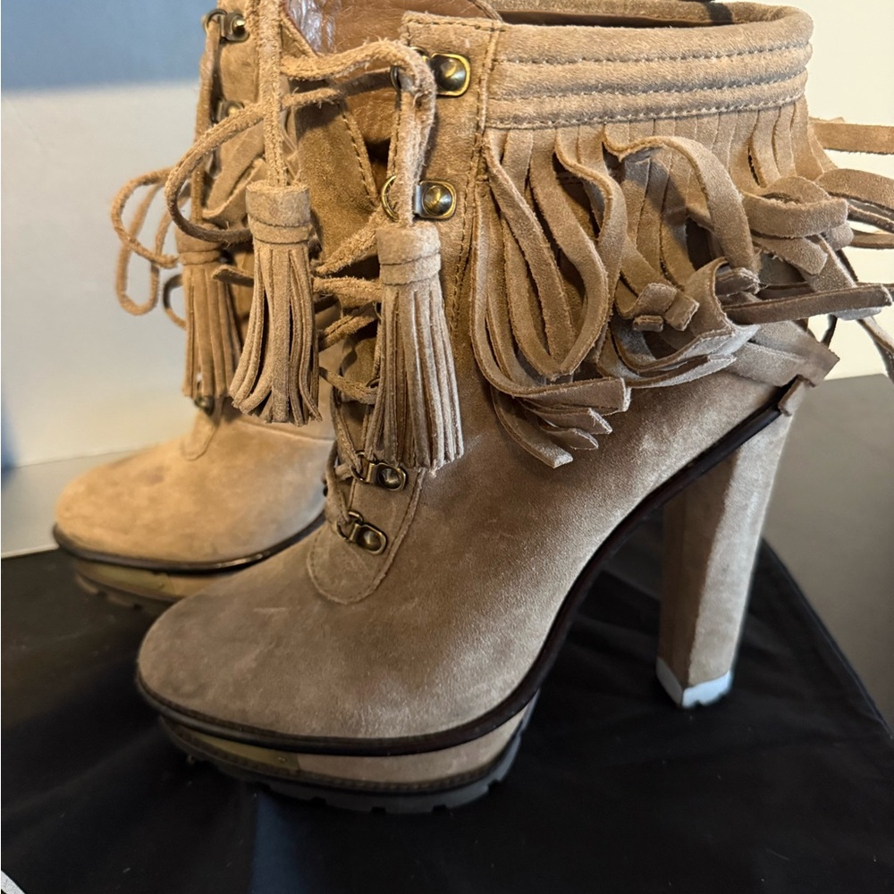 These authentic Brian Atwood Tan Lace Up Fringe Boots  are perfect for fall.